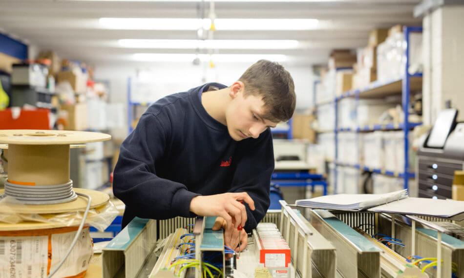 Employee inspecting cables