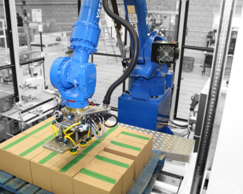 Automated machinery taping up boxes