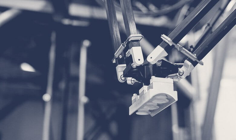 Close of black and white image of packaging machinery
