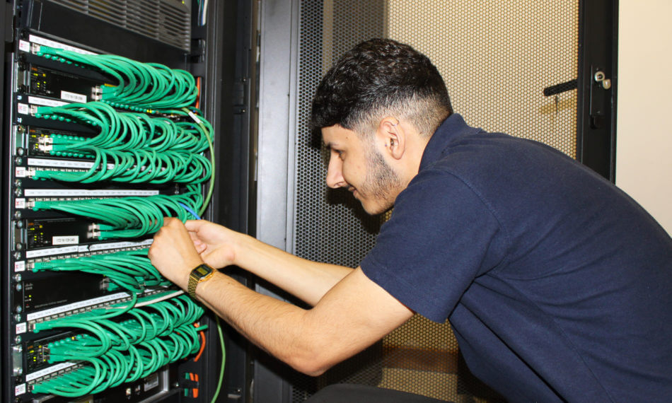 Engineer adjusting cables