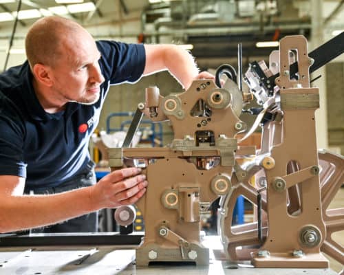 Engineer looking at an automated machine