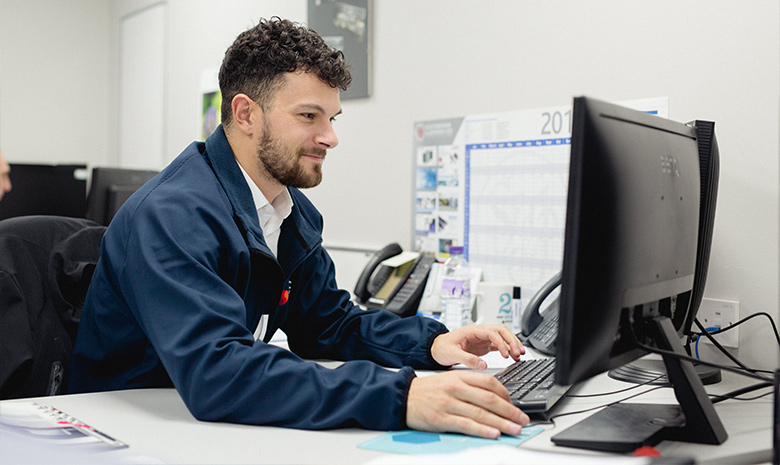Male employee working on a computer